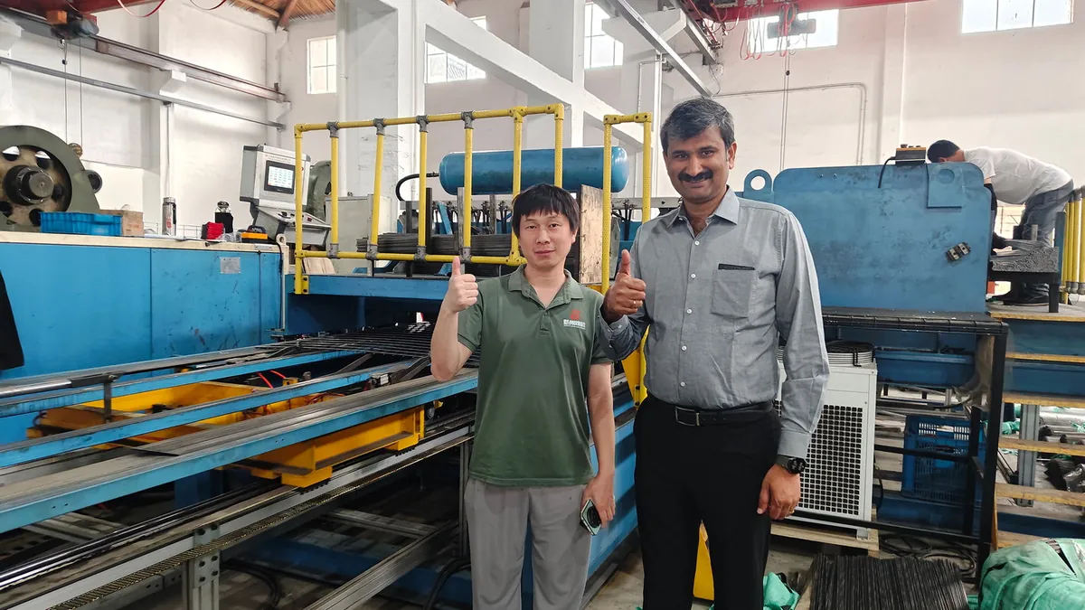 Xinzhou overseas service engineer with an international customer at their factory