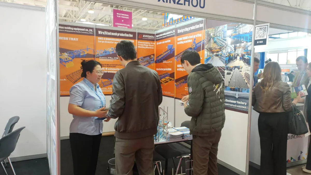 Xinzhou sales manager consulting with international customers at an industry exhibition